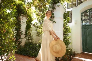 Elegant young woman walking alone while on a vacation